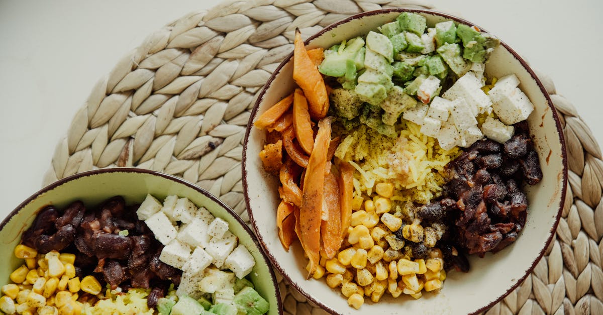 A smartphone showing glucose trend data alongside a plate of food with a meal tracking app