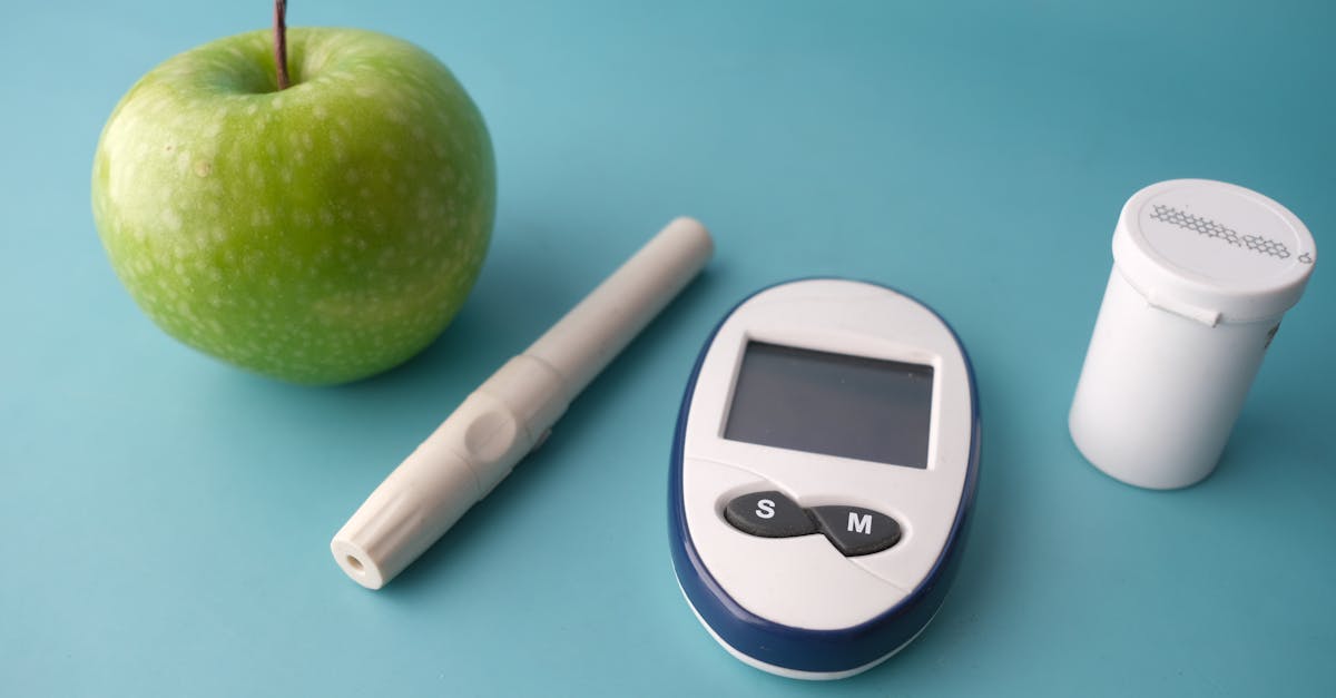 Travel medical kit with insulin pens, glucose meter, and snacks beside a boarding pass and passport